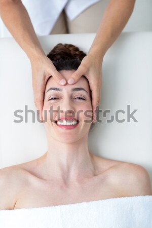 Attractive woman receiving back massage at spa center Stock photo © wavebreak_media