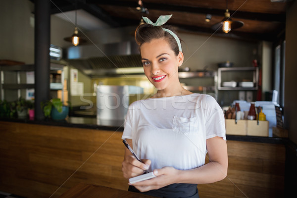 Portrait of smiling waitress in restaurant Stock photo © wavebreak_media