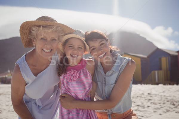 Stock photo: Portrait of smiling multi-generation family at beach
