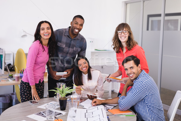 Smiling business people at desk Stock photo © wavebreak_media