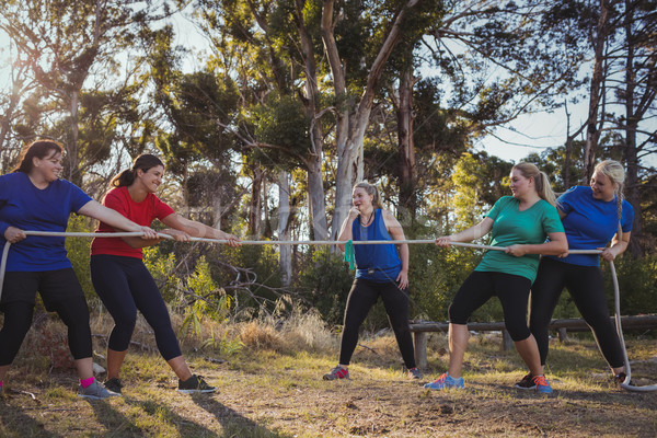 Group of women playing tug of war during obstacle course training Stock photo © wavebreak_media