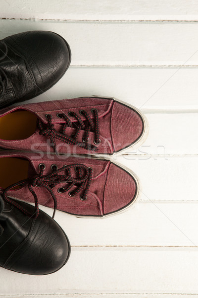 Pairs of new shoes on wooden plank Stock photo © wavebreak_media