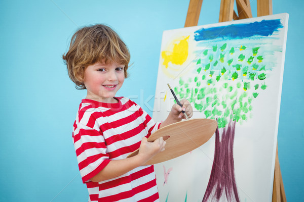 Happy boy painting his picture Stock photo © wavebreak_media