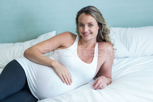 Pregnant woman touching her belly Stock photo © wavebreak_media