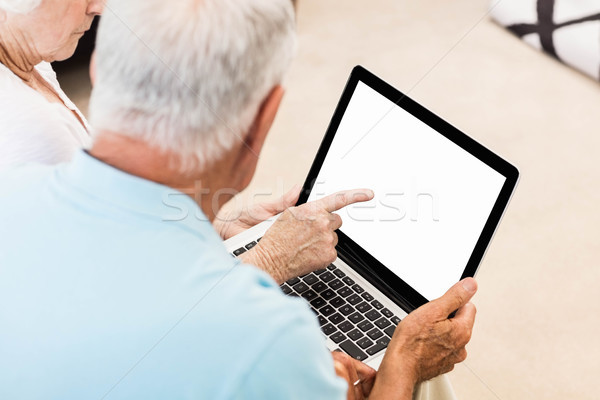 Stock photo: Focused senior couple using laptop