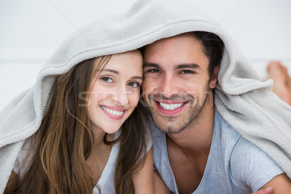 Portrait of smiling couple under blanket  Stock photo © wavebreak_media