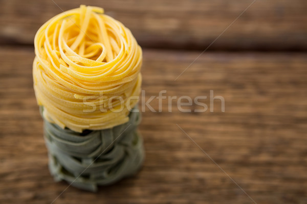 Tagliatelle pasta on wooden surface Stock photo © wavebreak_media