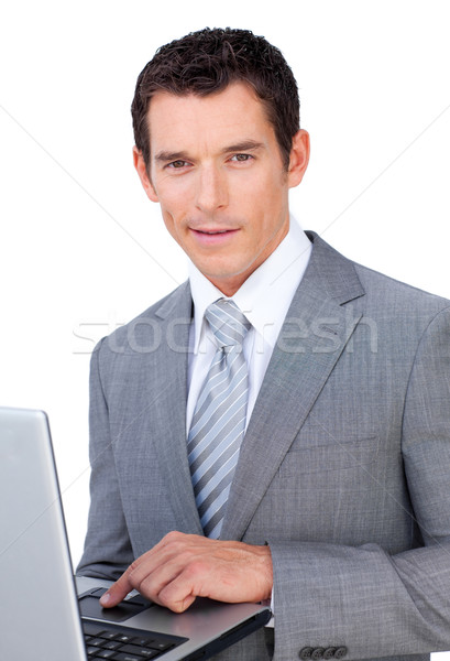 Carismático jovem empresário usando laptop isolado branco Foto stock © wavebreak_media
