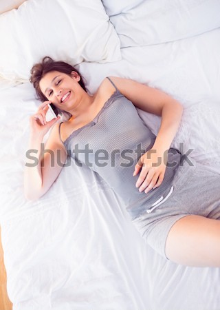 Elegancki kobieta bielizna bed domu twarz Zdjęcia stock © wavebreak_media