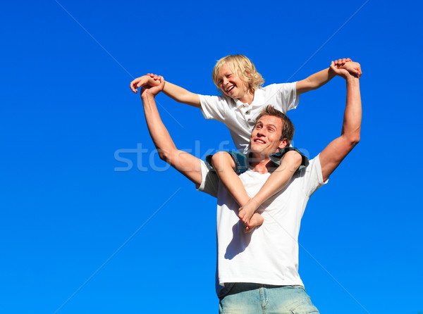 Stock photo: Boy giving kid a piggyback ride