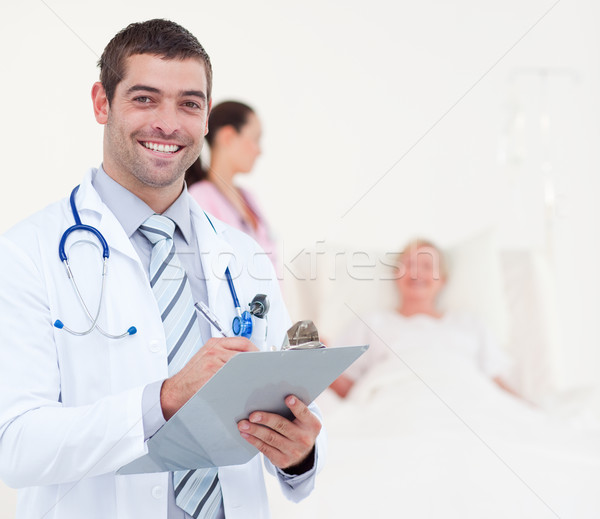 Stock photo: Doctors examining a female patient