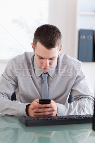 Close up of businessman reading text message carefully Stock photo © wavebreak_media