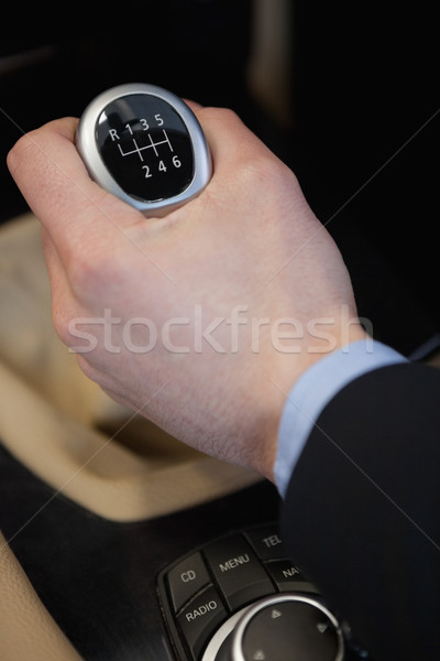 Man using a gear stick in a car dealership Stock photo © wavebreak_media
