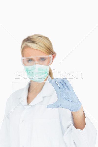 Female surgeon looking through clear pane Stock photo © wavebreak_media
