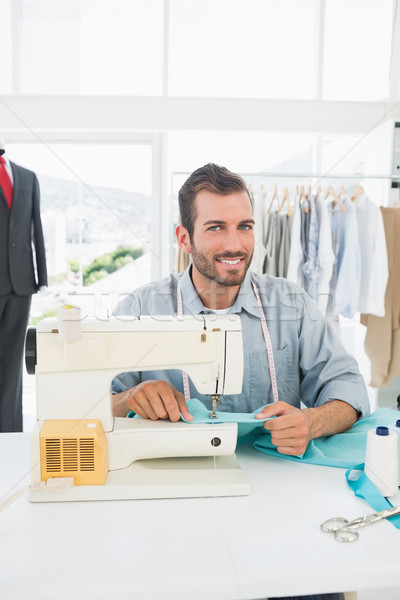 Smiling male tailor sewing in workshop Stock photo © wavebreak_media