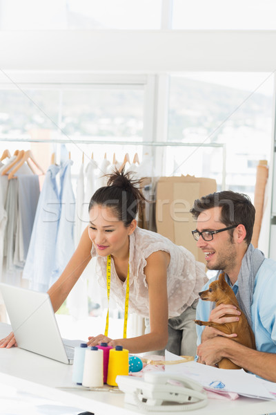 Fashion designers using laptop in studio Stock photo © wavebreak_media