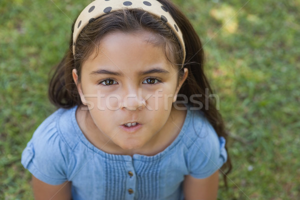 Portrait of a girl making faces at park Stock photo © wavebreak_media