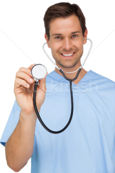 Stock photo: Portrait of a male surgeon using stethoscope