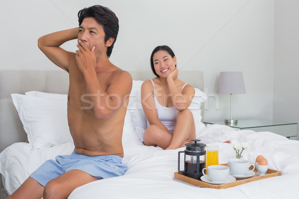 Femme souriante regarder copain bâiller maison chambre [[stock_photo]] © wavebreak_media