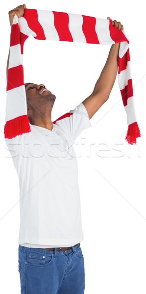 Happy football fan waving scarf Stock photo © wavebreak_media