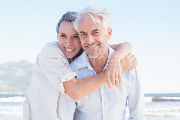 Attractive married couple posing at the beach Stock photo © wavebreak_media