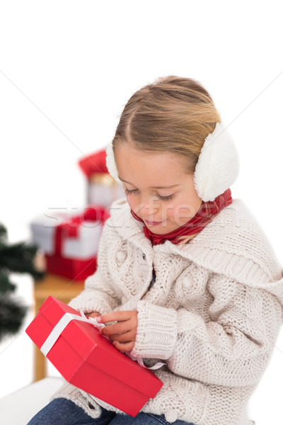 Festive little girl holding a gift Stock photo © wavebreak_media