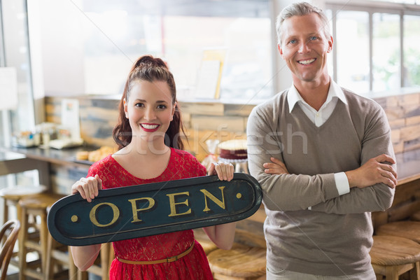 Stock photo: Cafe owners smiling at the camera