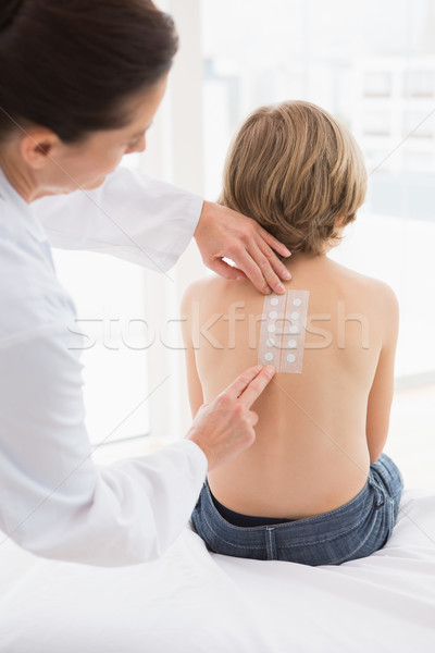 Doctor testing a childs skin Stock photo © wavebreak_media