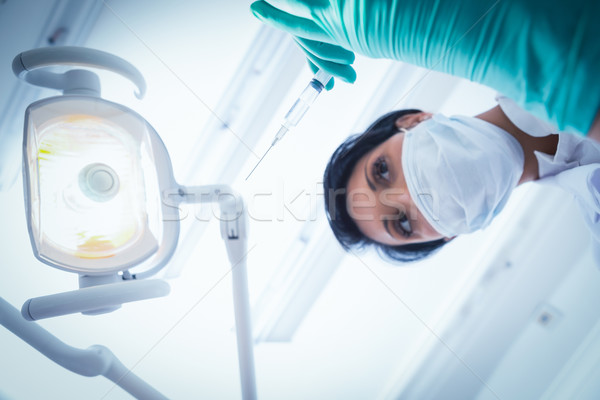 Femenino dentista mascarilla quirúrgica inyección Foto stock © wavebreak_media