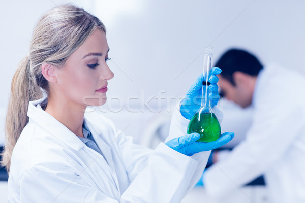 Ciencia estudiante verde químicos vaso Foto stock © wavebreak_media