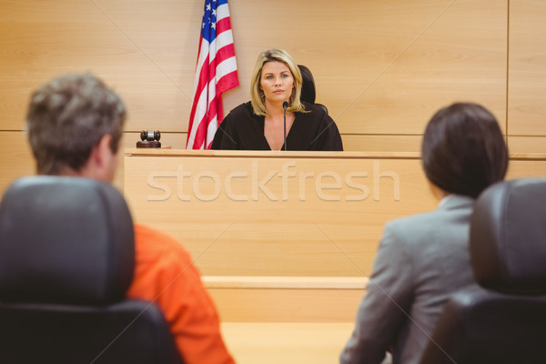 Judge and lawyer discussing the sentence for prisoner Stock photo © wavebreak_media