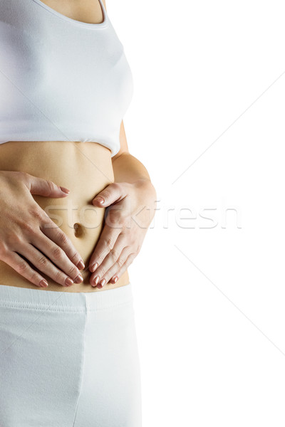 Stock photo: Slim woman touching her belly