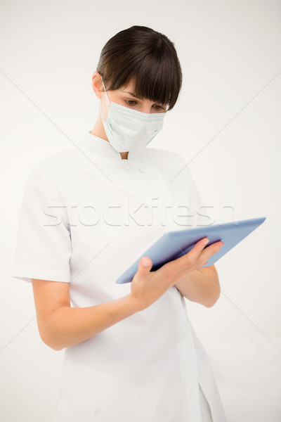 Stock photo: Nurse using a digital tablet 