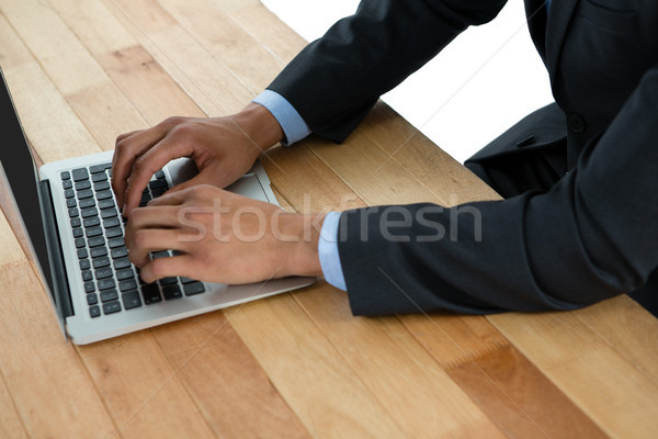 Mid section of businessman using laptop Stock photo © wavebreak_media