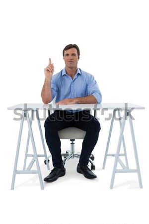 Male executive pressing an invisible virtual screen Stock photo © wavebreak_media