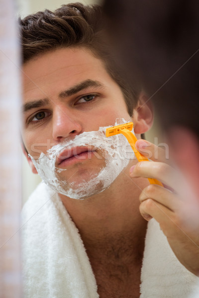 Réflexion jeune homme salle de bain miroir homme maison [[stock_photo]] © wavebreak_media