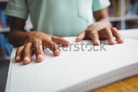 Boy using braille to read Stock photo © wavebreak_media