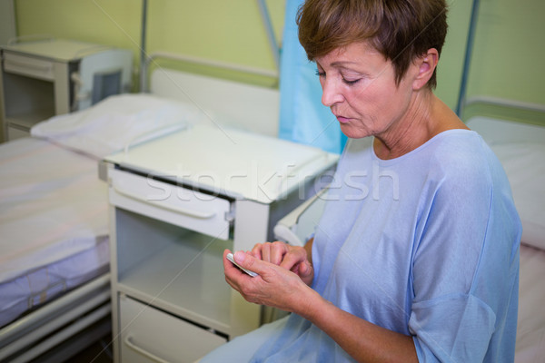 Sad senior patient using mobile phone  Stock photo © wavebreak_media