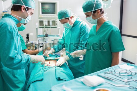 Foto stock: Equipo · cirujanos · paciente · operación · teatro · hospital