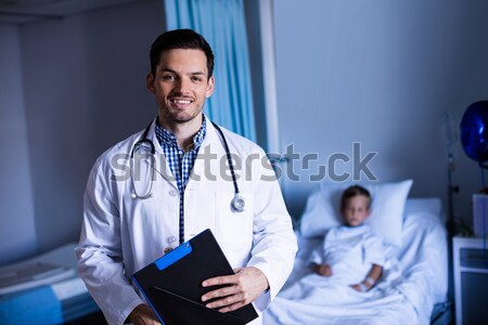 Portrait of male nurse sitting on staircase and using digital tablet Stock photo © wavebreak_media