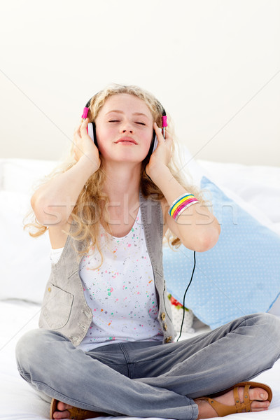 Beautiful teenager listening to the music Stock photo © wavebreak_media
