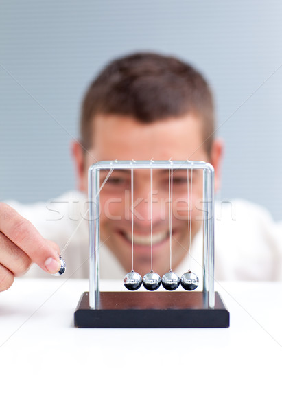 Businessman moving Newton balls Stock photo © wavebreak_media