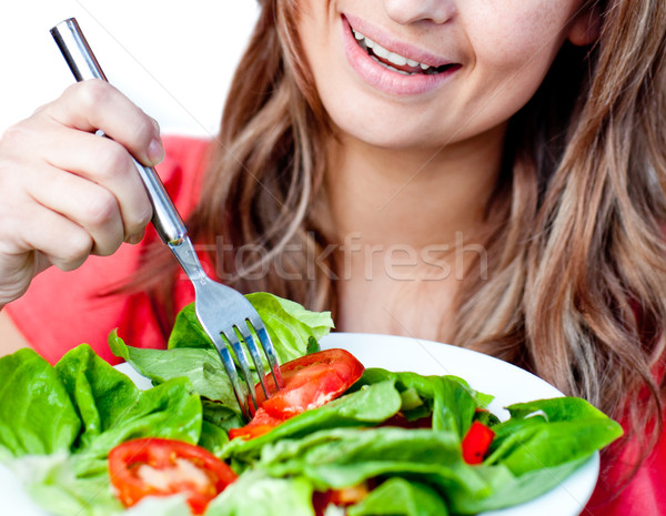 Radiant woman eating a healthy salad Stock photo © wavebreak_media