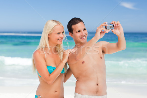 Couple taking a photo of the beach Stock photo © wavebreak_media