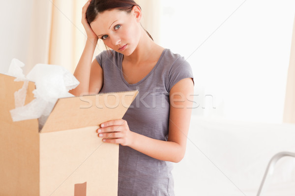 A female packing a cardboard in living room Stock photo © wavebreak_media