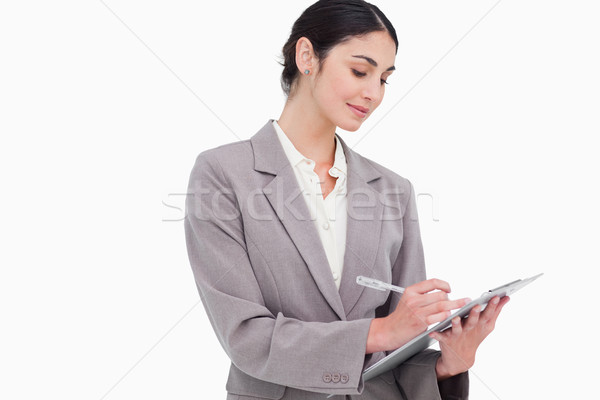 Businesswoman taking notes against a white background Stock photo © wavebreak_media