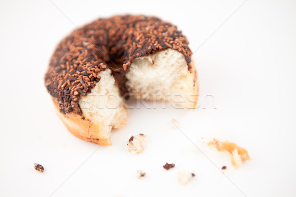 Chocolate doughnut with crumbs against grey background Stock photo © wavebreak_media