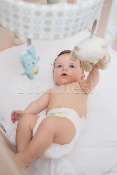 Adorable Baby Playing With Toys In Crib Stock Photo C Wavebreak