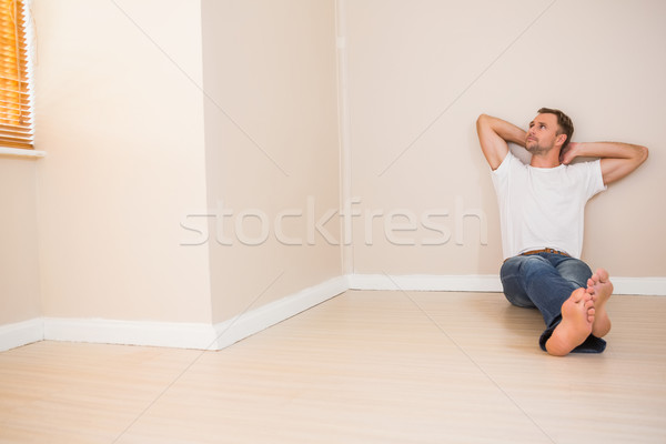 Happy man sitting on floor Stock photo © wavebreak_media