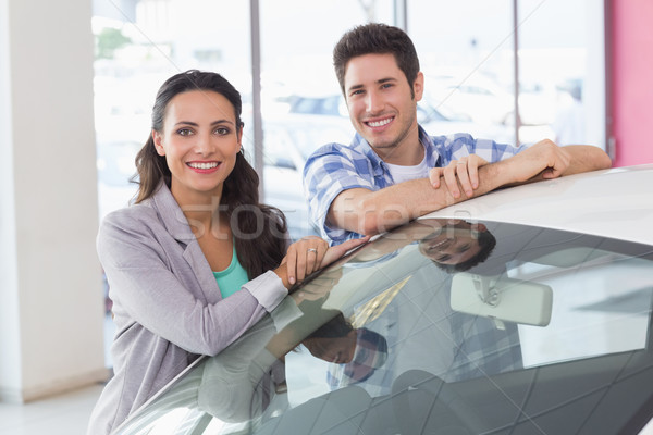 Smiling couple leaning on car Stock photo © wavebreak_media